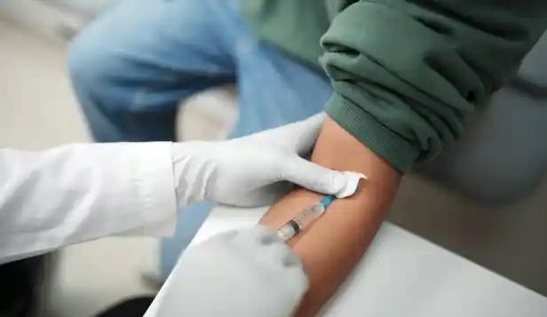 Close-up of a real venipuncture blood collection procedure